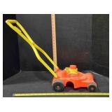 Plastic toy lawnmower, 21' at handle