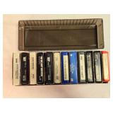 12 8-track tapes in plastic case