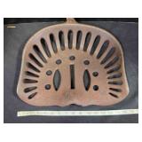 Vintage cast iron implement seat, intact