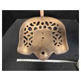 Cast iron implement seat, has been painted