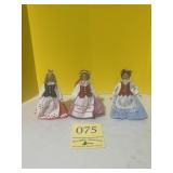 Three wooden dolls made in Poland