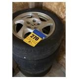Four aluminum factory Honda wheels with tires