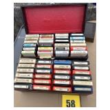 Two boxes of eight track tapes, including Charlie