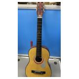 Guitar with steel reinforced neck