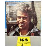 Vinyl record Fonzieï¿½s favorite happy days sit on