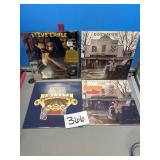 Vinyl records, Steve Earle, Randy Travis, and