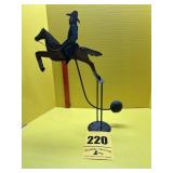 Vintage metal folk art balancing toy, cowboy on a