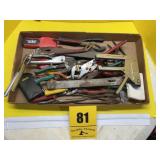 Flatt of pliers and leather punch and