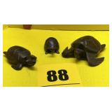 Three wooden turtles