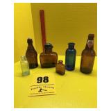 Several old bottles, medicine bottles, and other