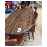 Table and four chairs with two extra leaves