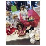 Nine dolls in tote