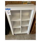 White shelf 42 inches high 28 1/2 inches wide and