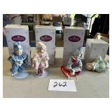 Four Ashton Drake dolls in the original boxes