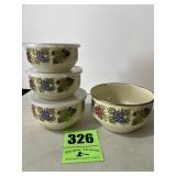 Nesting bowls, three of the four have lids