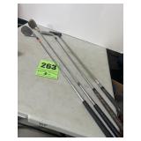 3 left-handed, golf clubs, and a putter