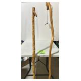 2) handmade walking sticks one is a draft