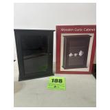 2 wooden curio cabinets, one still in the box