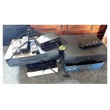 (2) Boxes w/2 VHS Players, Cords & Remotes