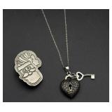 Silver necklace and brooch