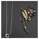 Silver necklace and brooch