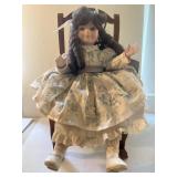 Baby Doll On A Rocking Chair