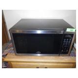 OSTER MICROWAVE- TURNS ON