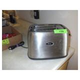 OSTER TOASTER- TURNS ON