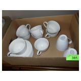 WHITE EMBOSSED CUPS & SAUCERS