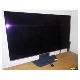 55" LG FLAT PANEL TV W/ REMOTE & STAND (TURNS ON)