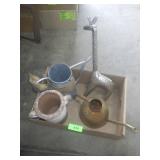 METAL GIRAFFE & WATERING CANS, TERRA COTTA WINE >>