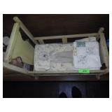 VINTAGE MUSICAL DOLL CRADLE, SMALL PORCELAIN DOLL