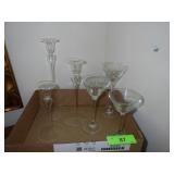 TWO SETS OF GRADUATED CANDLE HOLDERS