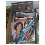 KNITTING NEEDLES AND BOOKS