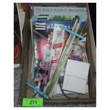 KNITTING NEEDLES AND BOOKS