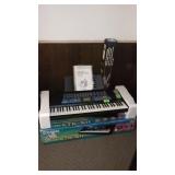 CASIO ELECTRIC KEYBOARD (TURNS ON) W/ STAND
