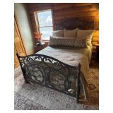 Queen bed with frame and bedding