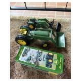 Metal John Deere tractors and tin