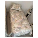 Single bed with linens and frame