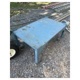 Iron table on castors