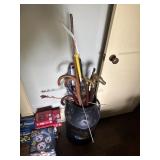 Milk can full of canes