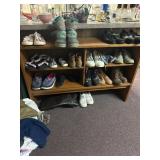 Shelf. Shoes,clothing and glass on ledge