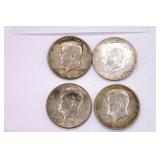 Four 1964 Kennedy Half Dollars