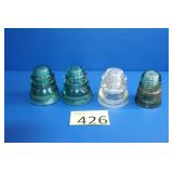 Four Glass Insulators