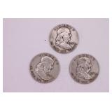 Three 1957 Franklin Half Dollar Coins