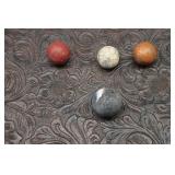 Four Clay "Commies" Marbles