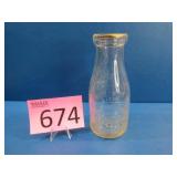 Vintage Embossed Pint Milk Bottle
