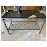 Metal framed table on casters with glass top-36x