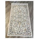 Small rectangular washable polyester rug from pet