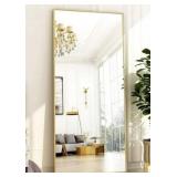 Large rectangular floor mirror with gold frame.